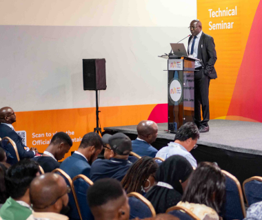 Man standing at technical seminar stand