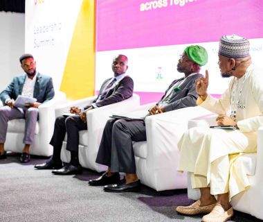 Panelists at an exhibition discussing topics